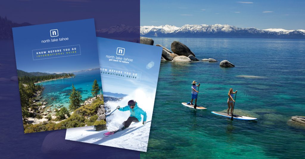 Couple stand up paddle boarding on Lake Tahoe