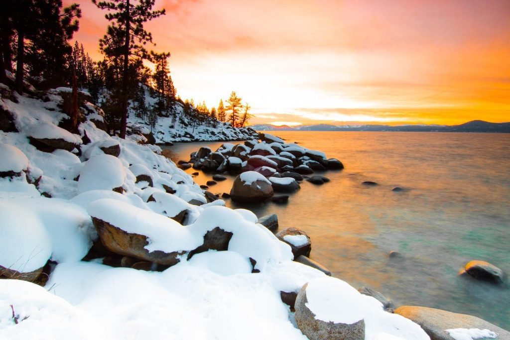 Snowy rocky shores of Lake Tahoe 