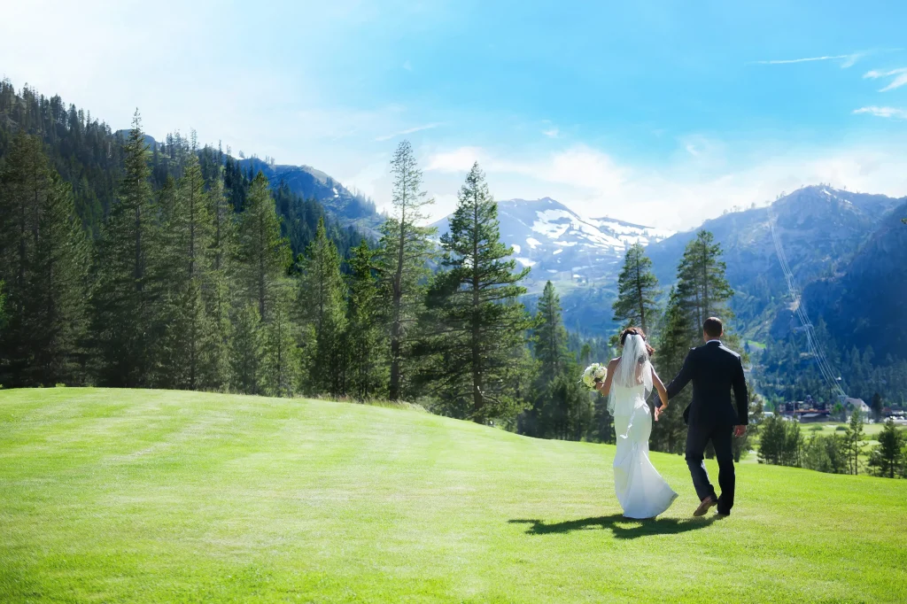 Couple enjoying a sunny view on their wedding day