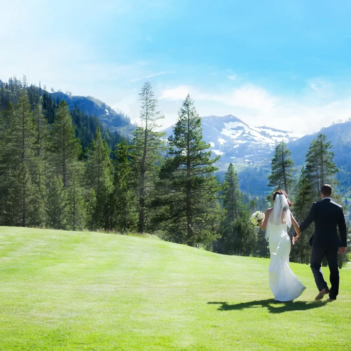 Couple enjoying a sunny view on their wedding day