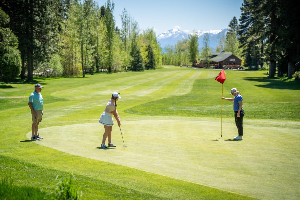 Group of people golfing 