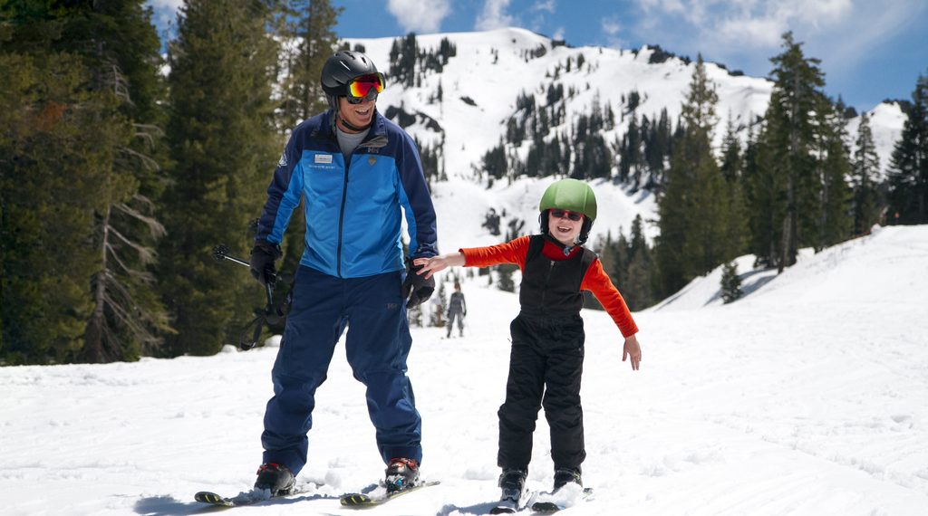 Man and child skiing