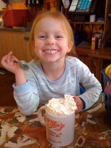 Young girl enjoys hot coco at Squeeze In during family vacation in Lake Tahoe