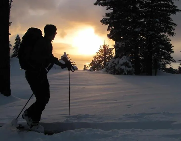 Snowshoeing at dusk in Lake Tahoe Alpenglow