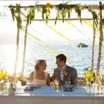 Couple at their wedding sitting at a table