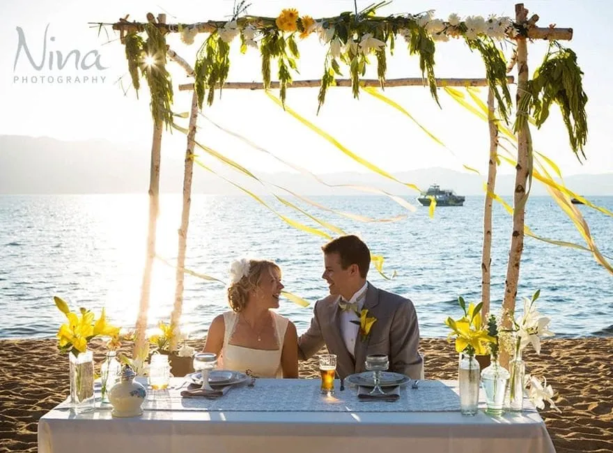 Couple at their wedding sitting at a table