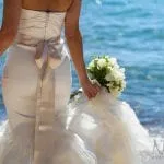 Bride holding her bouquet next to Lake Tahoe