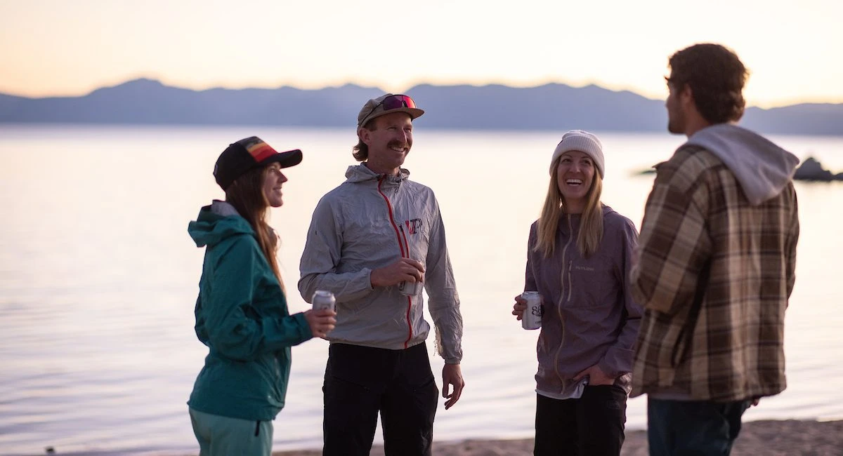 Group of friends drinking on Sand Harbor beach in Lake Tahoe
