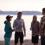 Group of friends drinking on Sand Harbor beach in Lake Tahoe