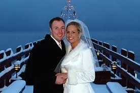 Couple standing outside on a snowy evening in Lake Tahoe