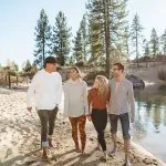 Friends walking beach at Sand Harbor in Lake Tahoe
