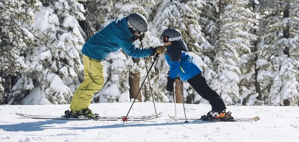 Parent and child enjoying their Northstar Family Skiing