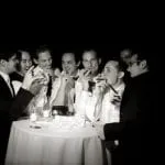 Wedding party all around a small circular table