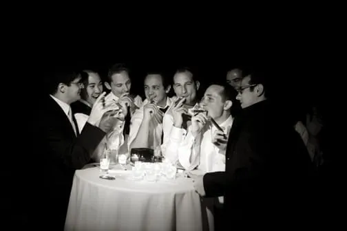 Wedding party all around a small circular table