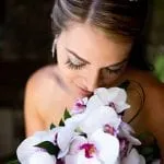 Bride looking at some flowers on her wedding day