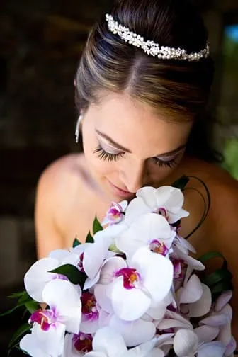 Bride looking at some flowers on her wedding day