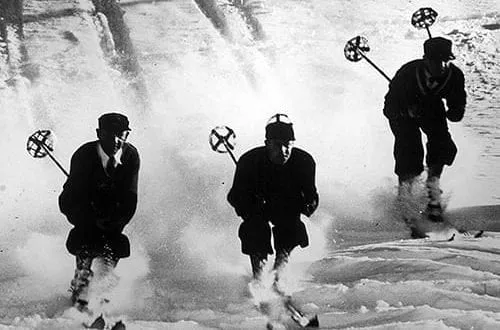 Sugar Bowl Historical shot of three men skiing down a snowy slope