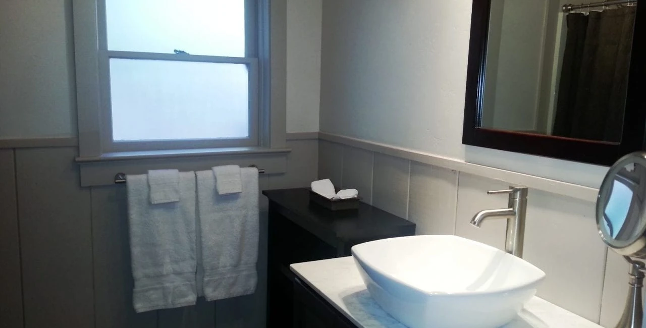 Interior restroom shot of the sink and towels