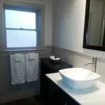 Interior restroom shot of the sink and towels