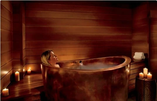 Woman in a luxurious bath tub in lake Tahoe