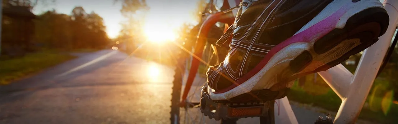 Photo of a persons foot on a bike pedal