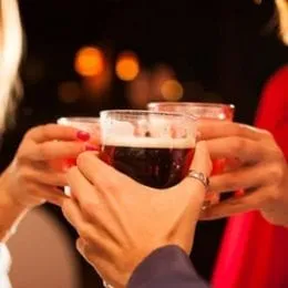 Clinking drinks in a holiday setting in Lake Tahoe