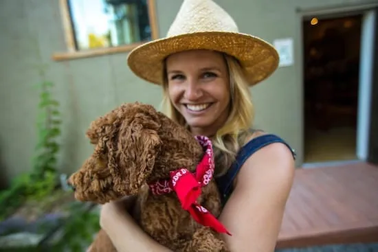 Happy dog owner holding her dog in Lake Tahoe 