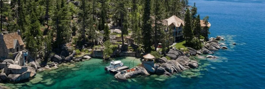 A boat on the clear waters of Lake Tahoe docked in a bay