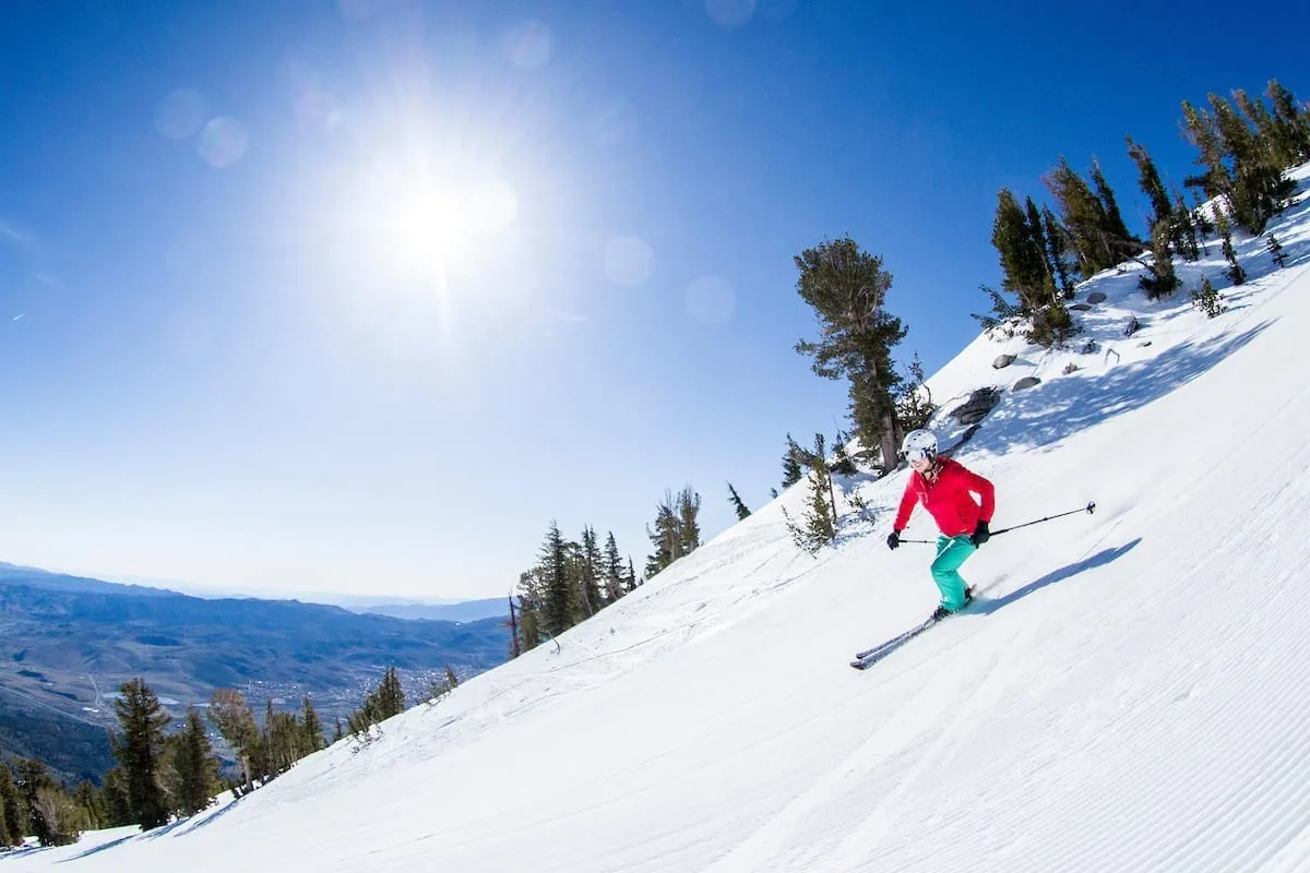 Person in Red Jacket Skiing down the powdery slopes of Lake Tahoe