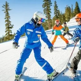 Kids take ski lessons with instructor at Northstar Mountain Resort in Lake Tahoe