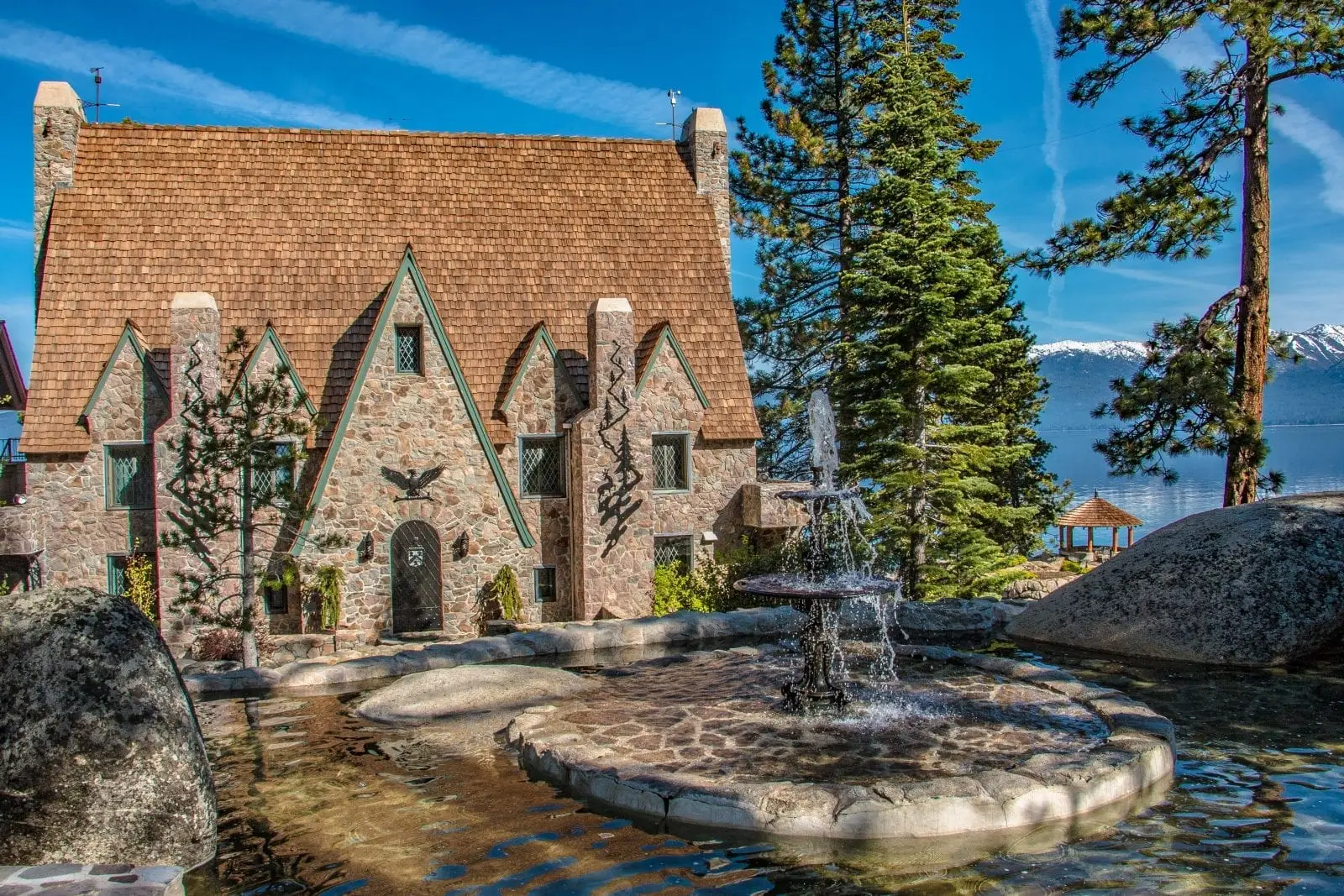 Stone house with a fountain out front