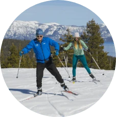 Man and woman cross country skiing in Lake Tahoe during winter