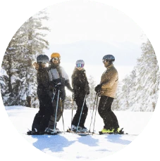 Lake Tahoe winter scene of skiers stopping to talk on slopes