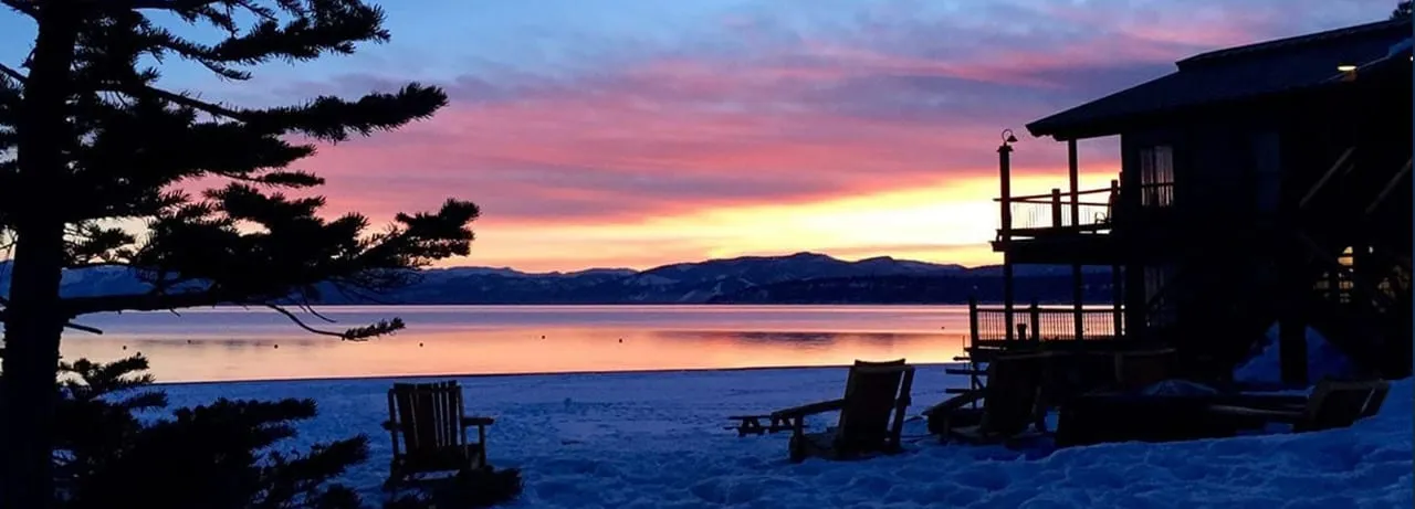 Chairs facing a winter sunset