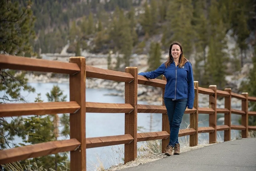 Amy Berry posing on a path next to Lake Tahoe