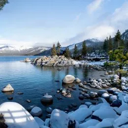 Snow covered rocks at Sand Harbor in Lake Tahoe during winter