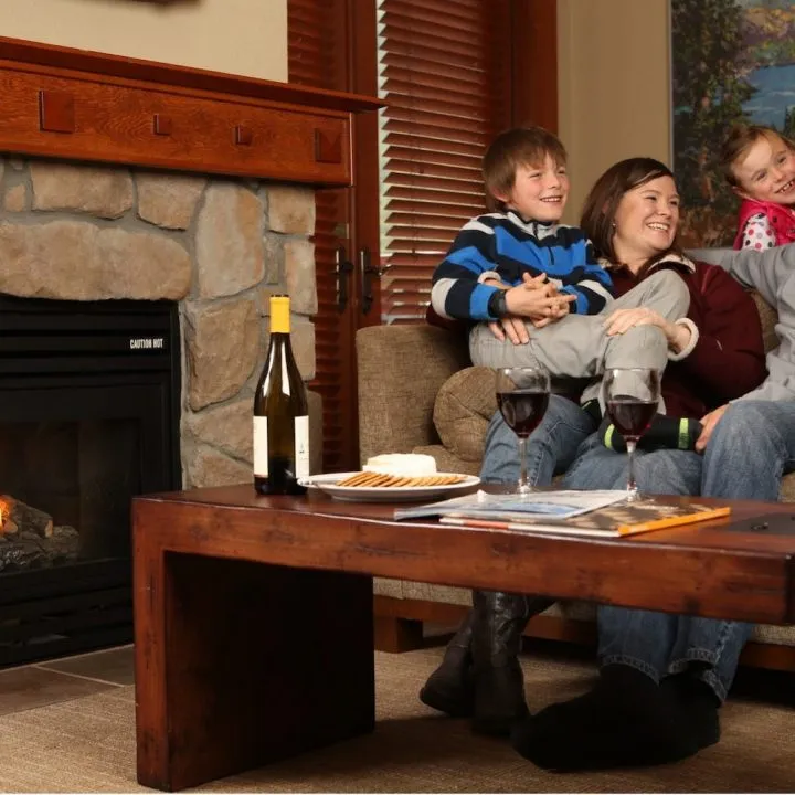 Family enjoying their time by the fire
