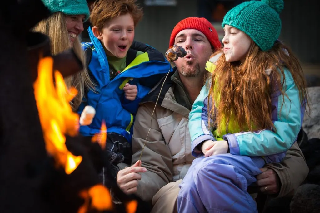 Family enjoying some smores on a winter day 