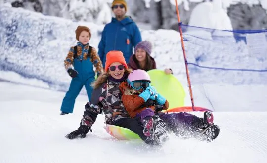 Family of four Sledding at Granlibakken Lake Tahoe