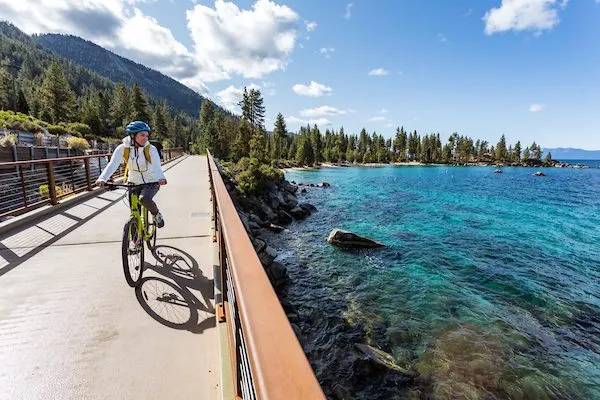 Woman riding her bike on a planned path in Lake Tahoe