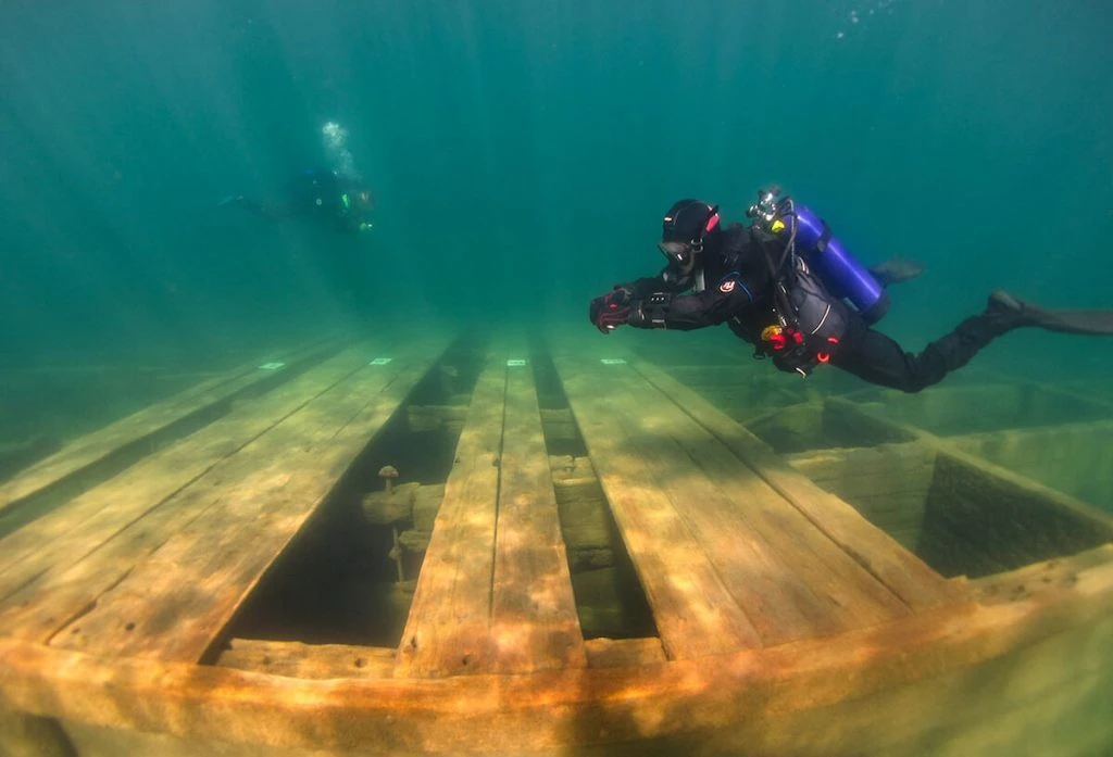 Scuba divers exploring the depths of the Lake Tahoe