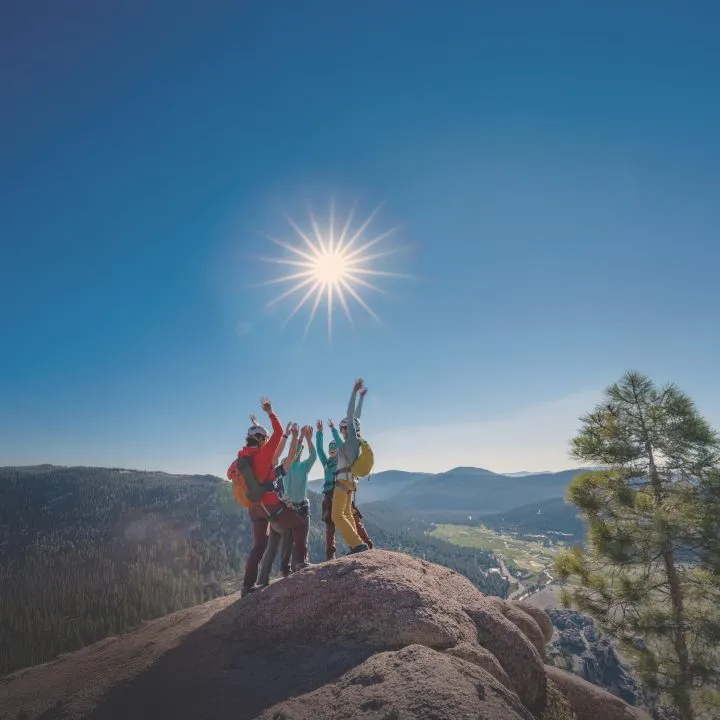 Group on a hike high-fiving