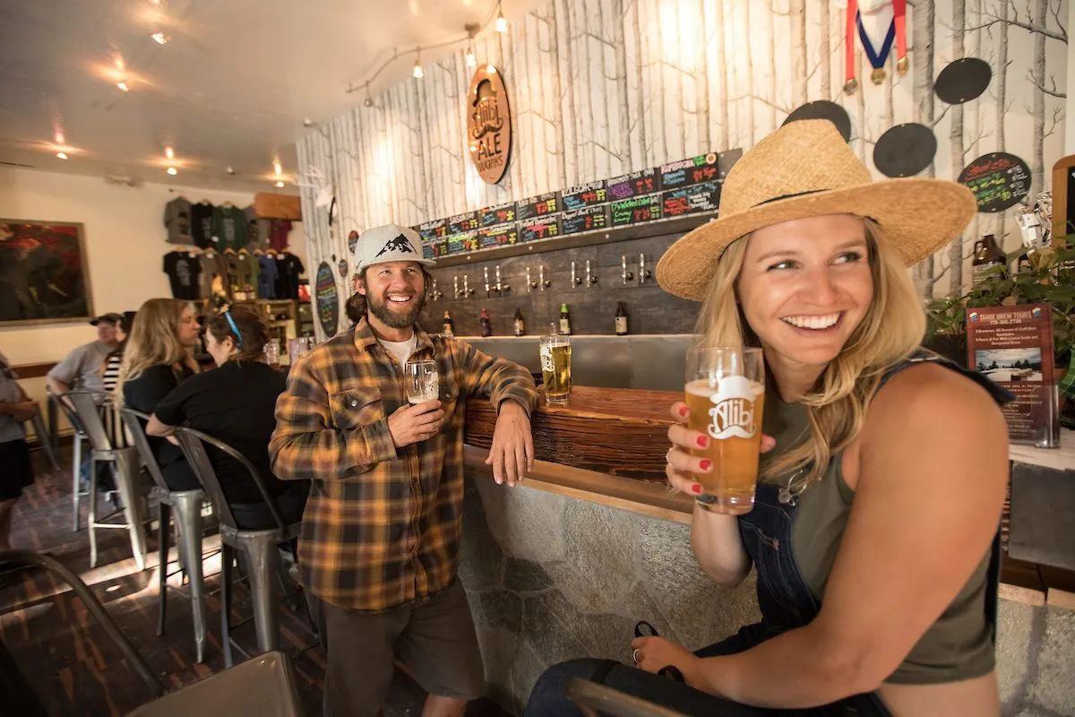 Couple drinking beer at Alibi Ale Works