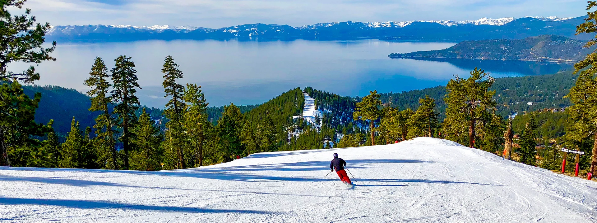 Person Skiing down a snowy slope in Lake Tahoe