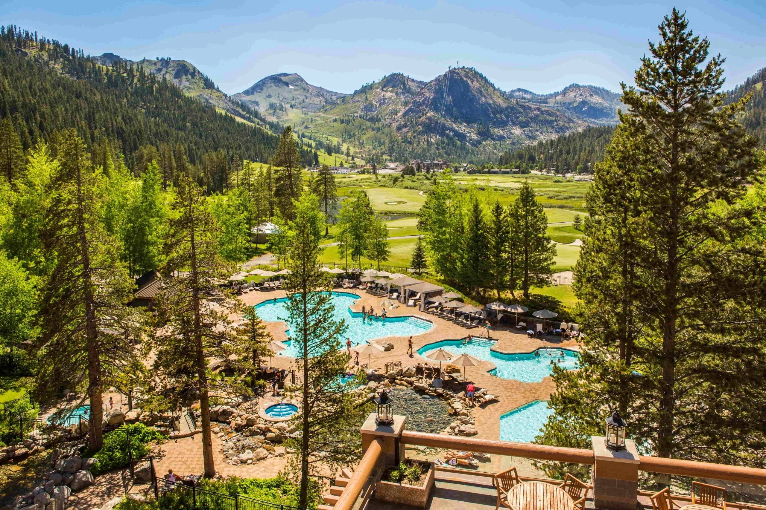 Mountain resort with outdoor pools and alpine views.