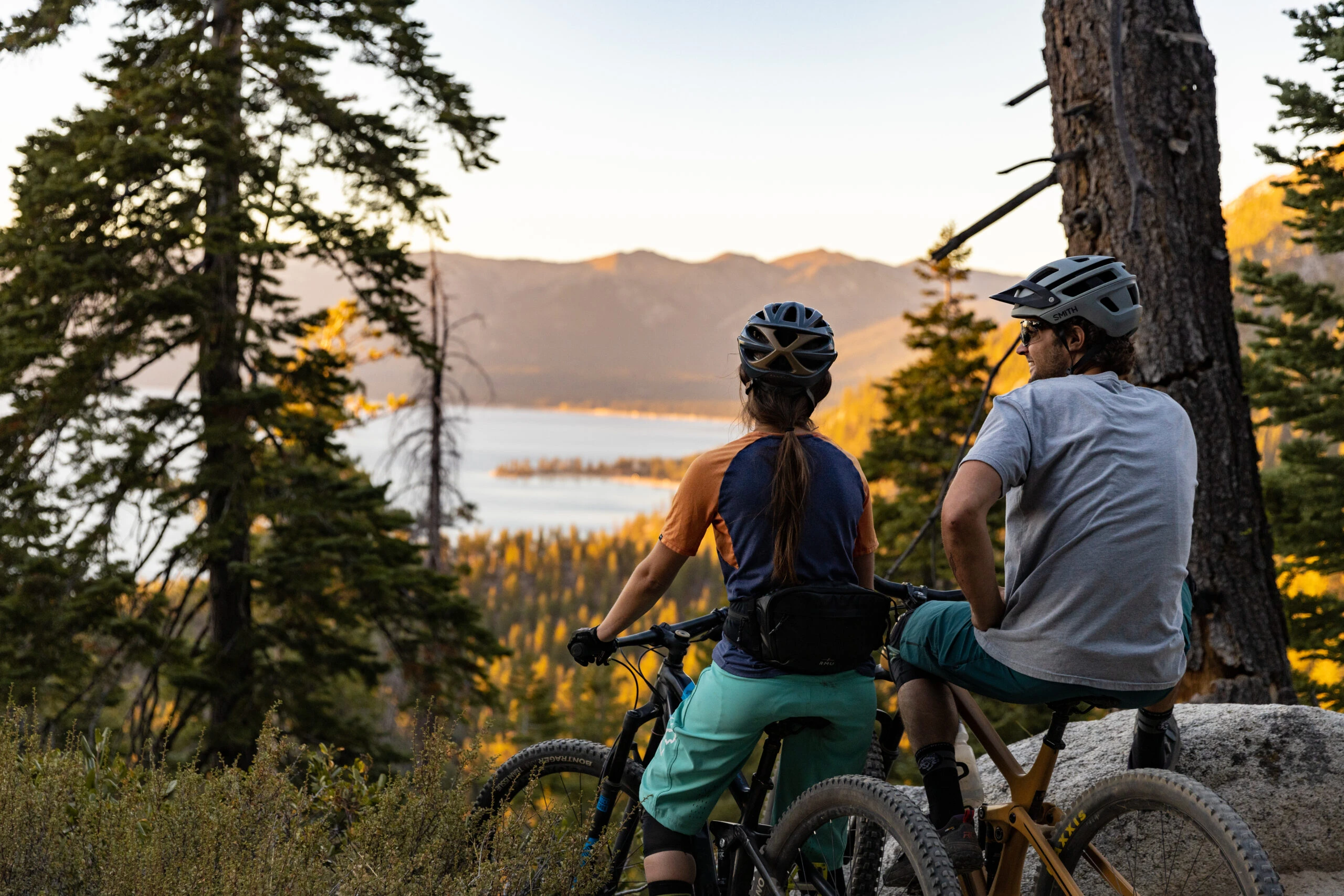 Couple mountain biking in Lake Tahoe at sunset