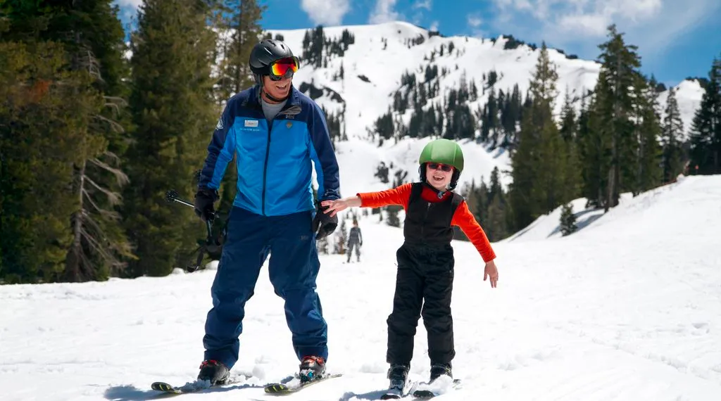 Man and child skiing